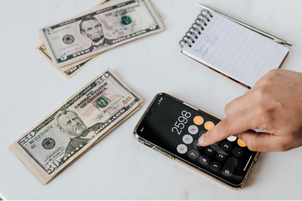 A person calculating cash