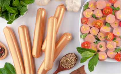 This image shows garlic, mint leaves, sausages and baby tomato