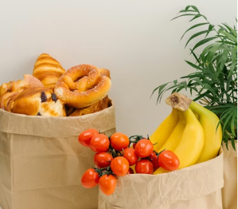 This image shows selection of baked goods and fresh fruits packed together